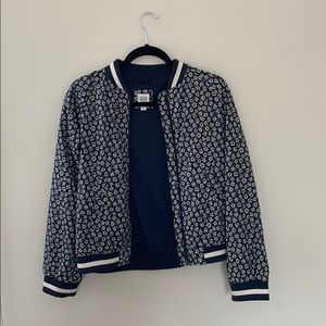 Navy and white floral bomber jacket.